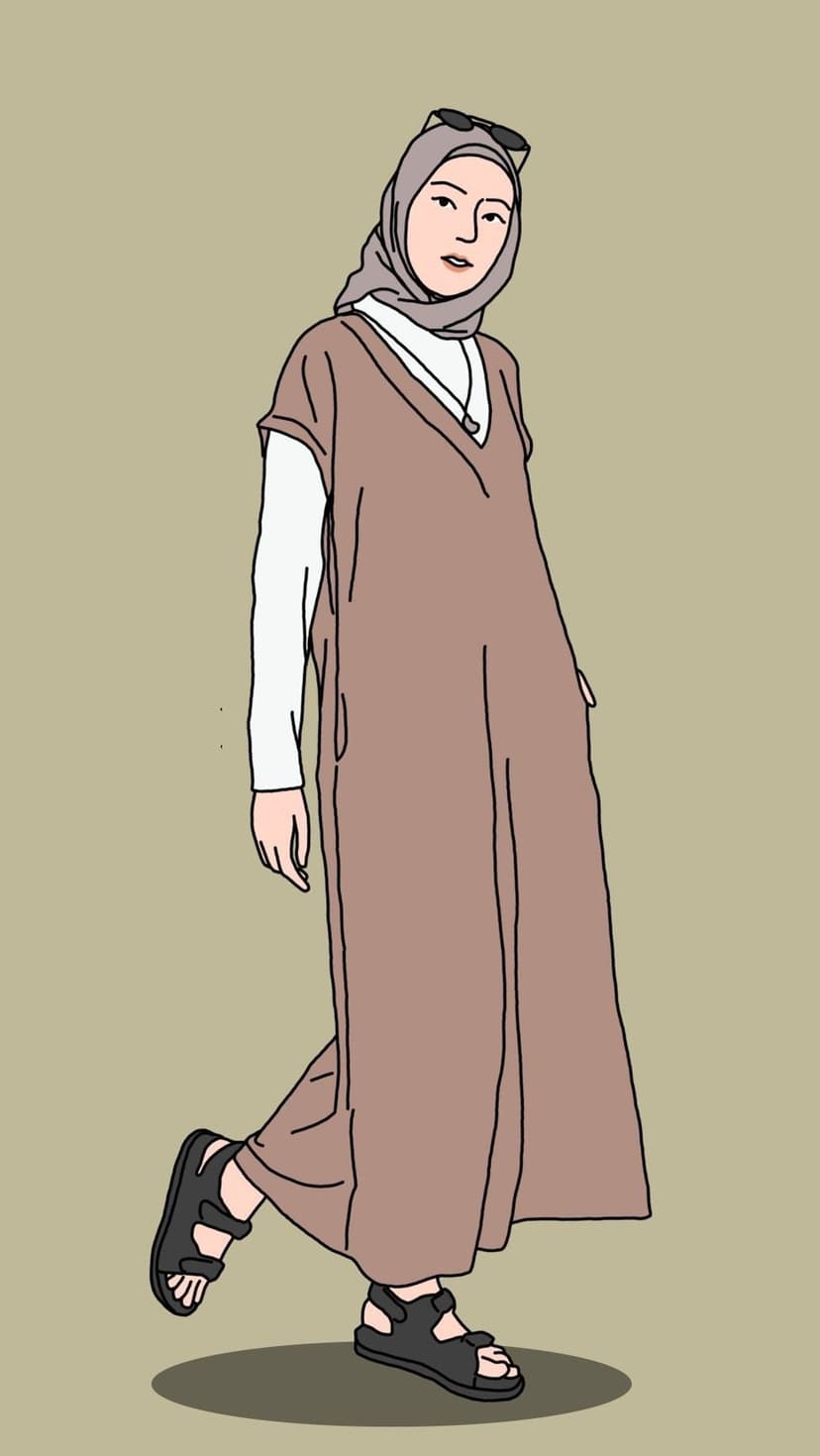 Woman in a brown maxi dress, white long sleeves, and grey headscarf stands against a solid tan backdrop.