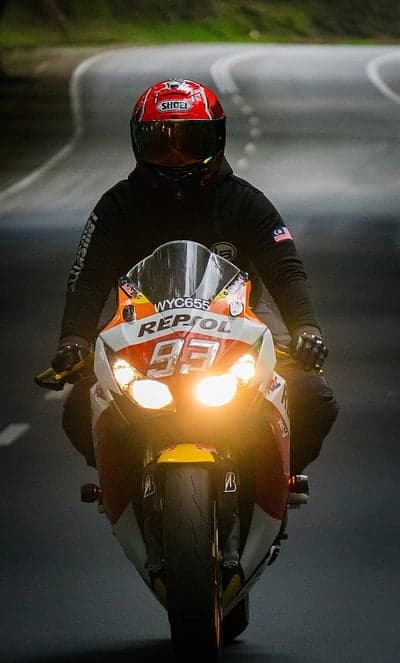 Sportbike Rider in Red Helmet Racing Phone Wallpaper