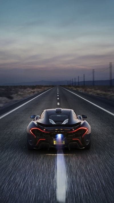 McLaren P1 Speeding Down Desert Highway at Dusk