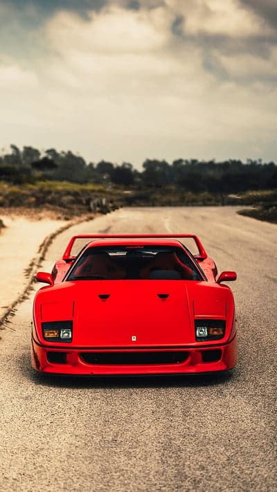 Red Ferrari F40 on a Dusty Road
