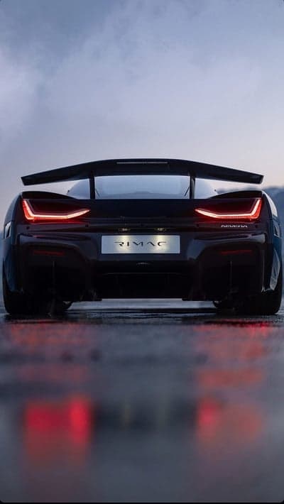 Rimac Nevera rear view, sleek electric hypercar on wet road