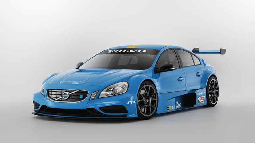 Blue Volvo S60 Polestar TTA race car with a large rear wing and black wheels on a white studio background.