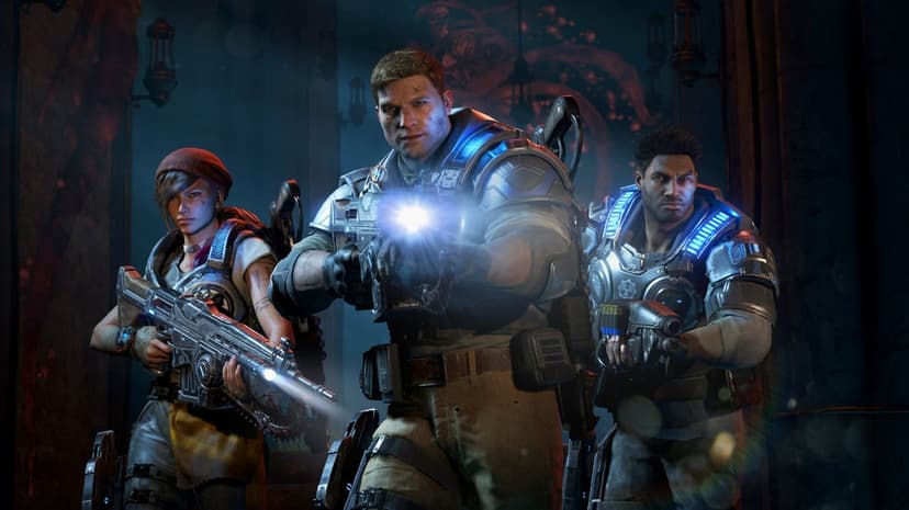 JD Fenix aims a rifle with a bright flashlight alongside Kait Diaz and Del Walker in heavy blue armor.