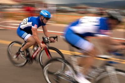 Pro Cyclists Racing Motion Blur Mobile Background