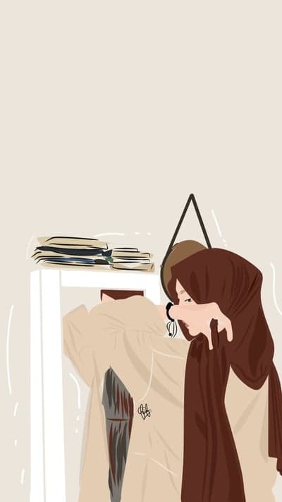 Person in hijab adjusting clothes in front of mirror