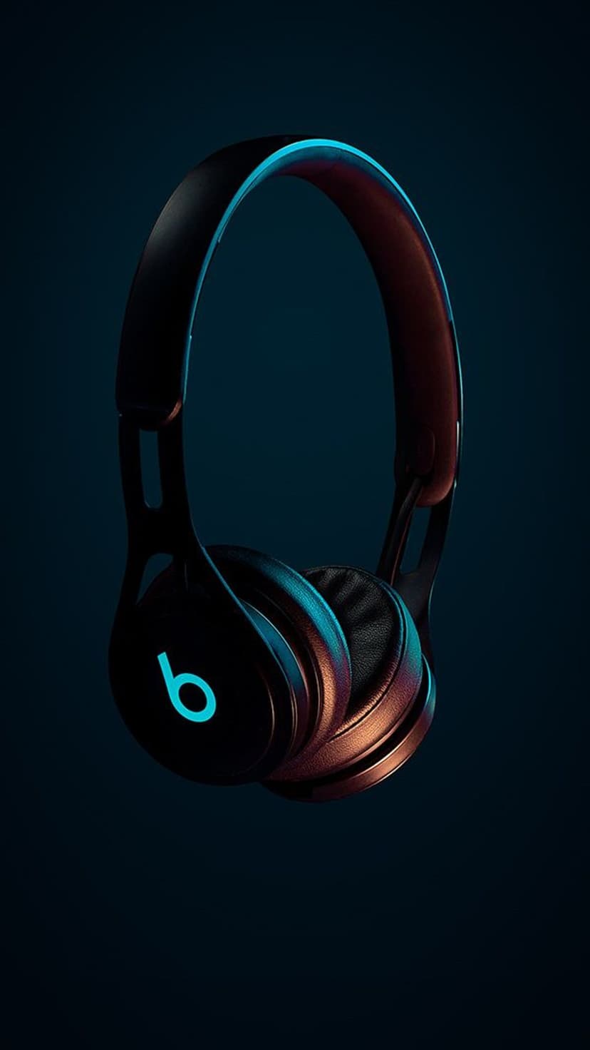 Matte black headphones featuring a glowing cyan logo and warm orange rim lighting against a dark background.