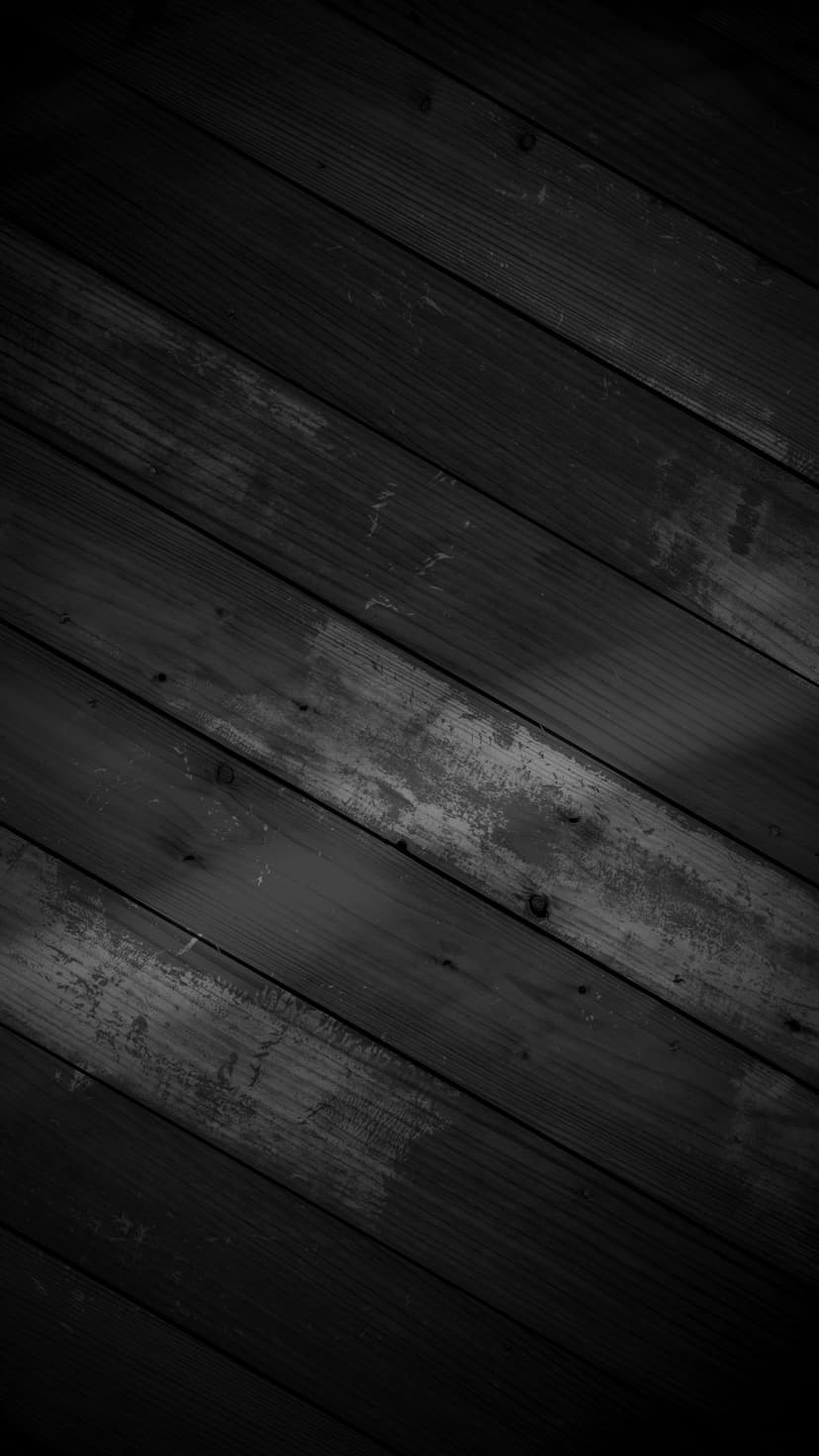 Dark wooden planks arranged in a diagonal pattern featuring natural grain, knots, and weathered surface textures.