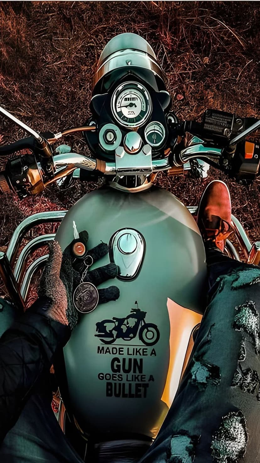Royal Enfield fuel tank with vintage decal, rider's gloved hand holding keys, and chrome handlebars.