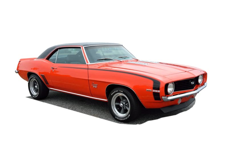 Orange 1969 Chevrolet Camaro SS with black racing stripes, chrome trim, and a black vinyl roof in portrait view.
