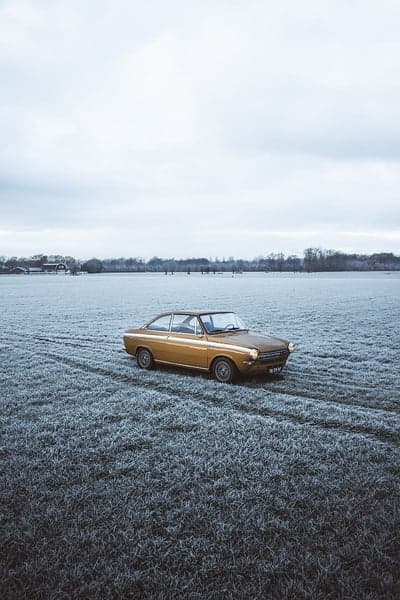 Vintage Gold Automobile in Muted Winter Field Wallpaper