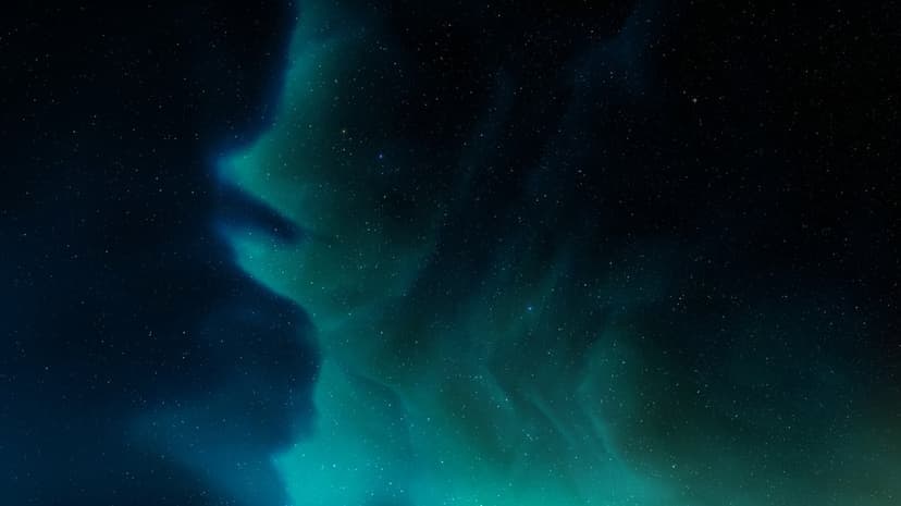 Electric blue and teal gas clouds swirl around bright white stars against a black deep space background.