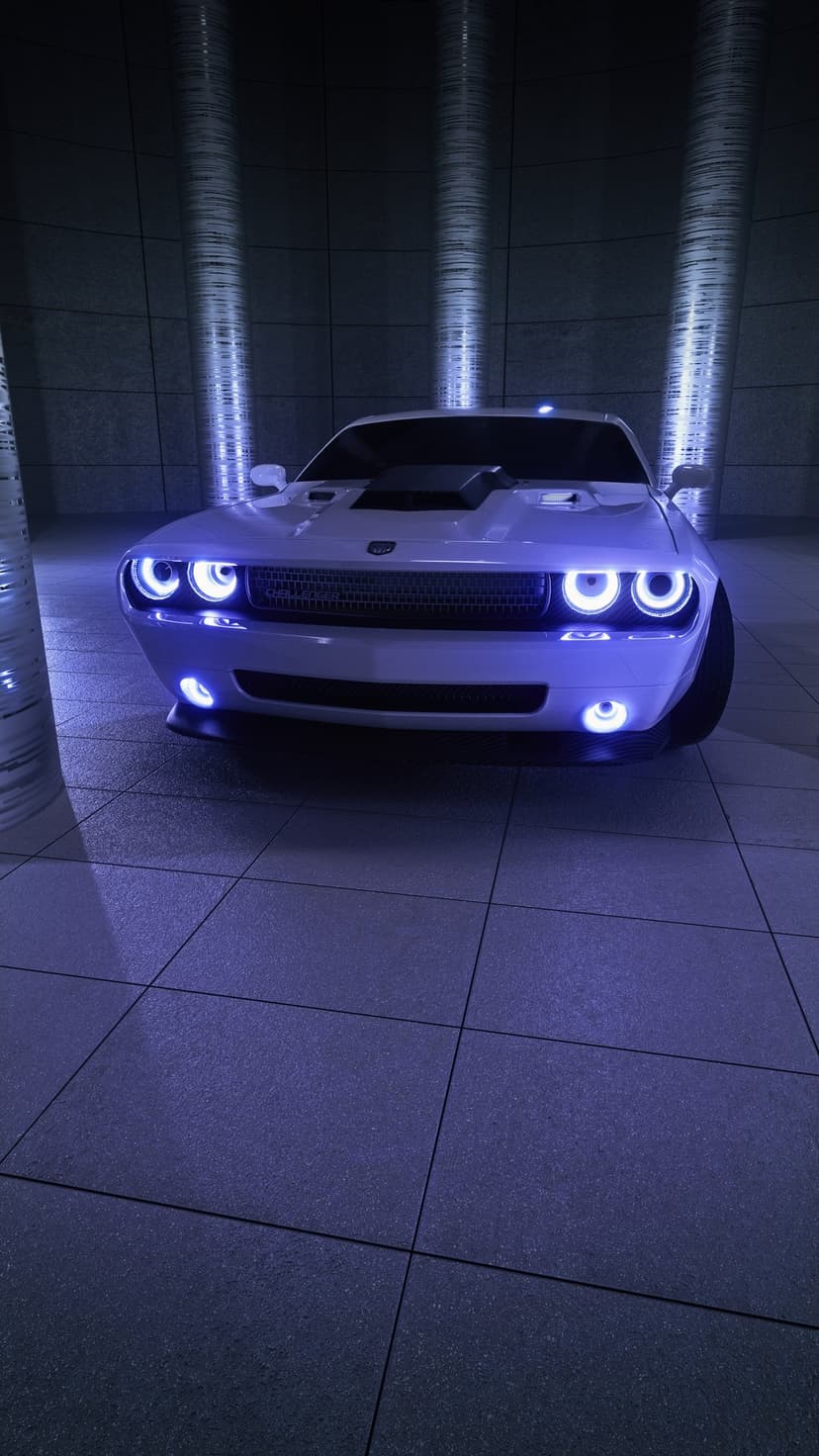 White Dodge Challenger with glowing blue neon headlights and underglow parked on tiled floors in a dark garage.