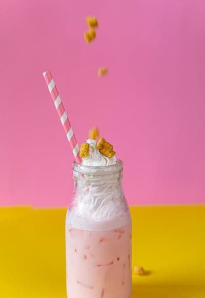 Pink Strawberry Milkshake with Whipped Cream and Cereal