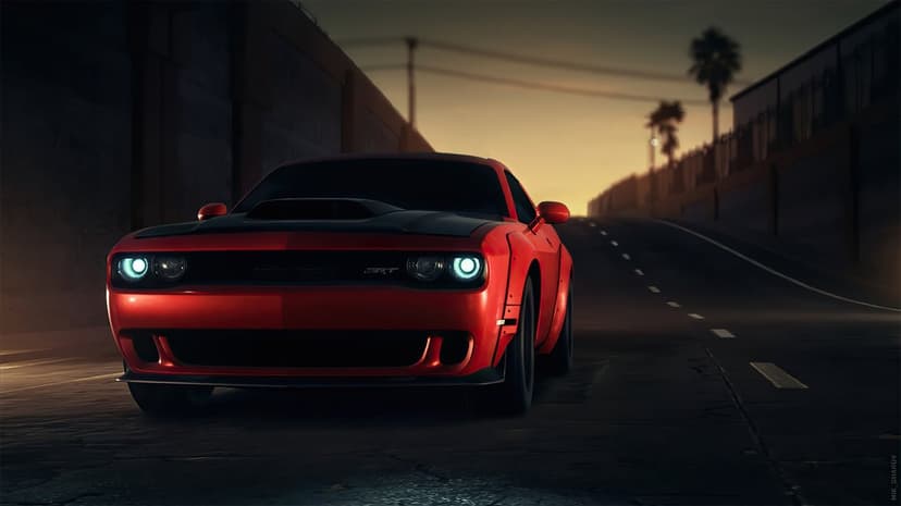 Red Dodge Challenger SRT with glowing headlights on a road at sunset with palm trees in the background.
