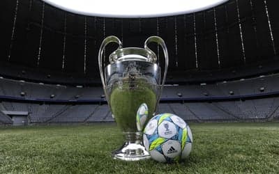 Champions League Trophy and Ball in Stadium