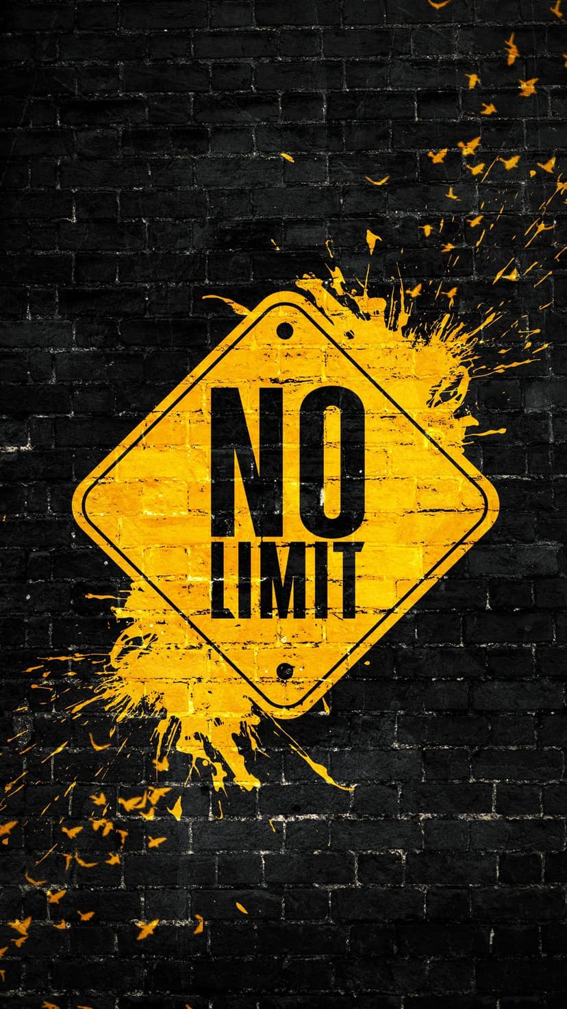 Yellow diamond sign with NO LIMIT text on a black brick wall with bright paint splatters and grunge texture.