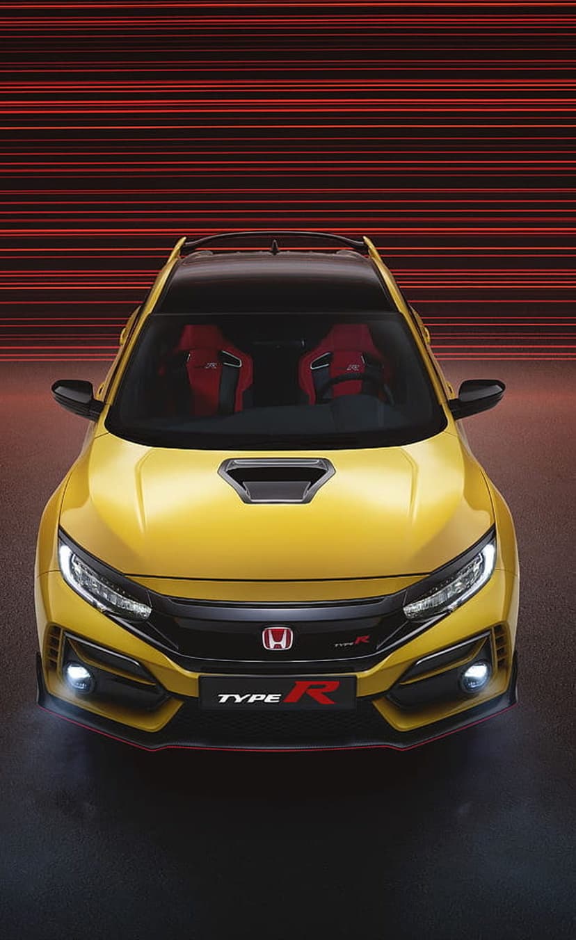 Yellow Honda Civic Type R featuring aggressive front grilles and red accents against a striped background.