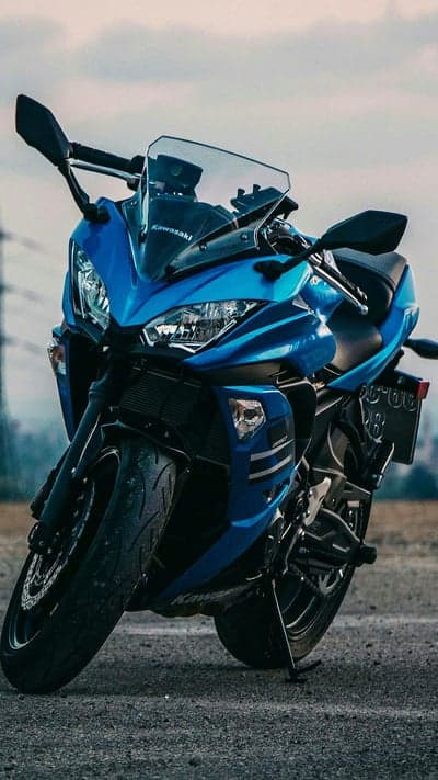 Blue Kawasaki Ninja Motorcycle in Motion