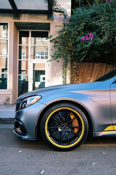 Gray Mercedes AMG with Yellow Accents Parked Outdoors