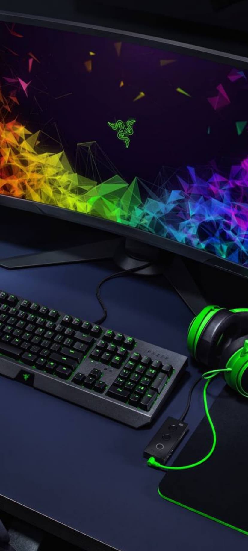 Razer mechanical keyboard and green headphones glow with neon lights against a geometric monitor screen background.