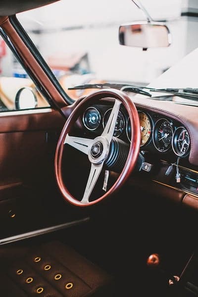 Classic Car Interior: Vintage Steering Wheel and Dashboard