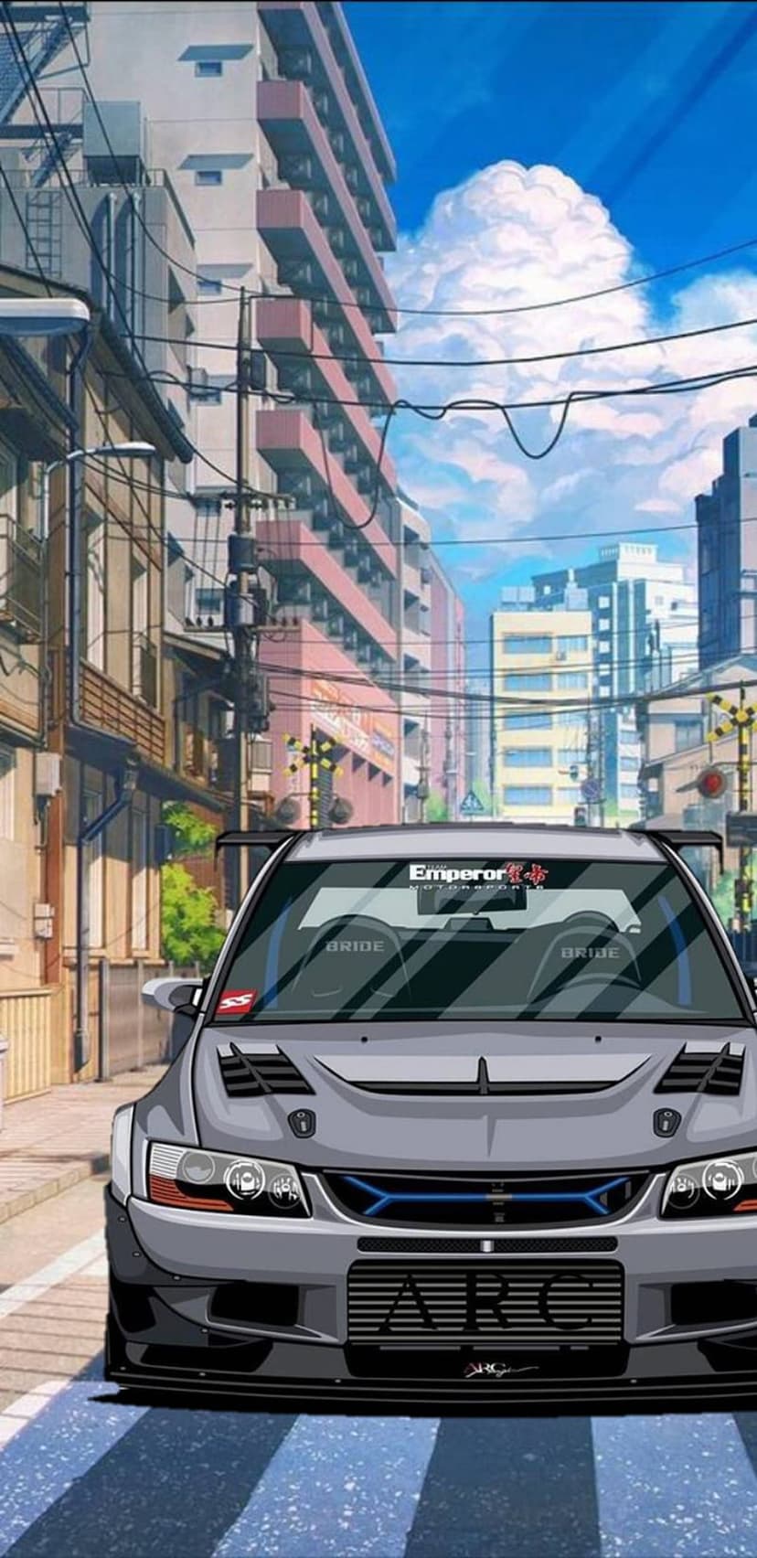 Mitsubishi Lancer Evolution with a widebody kit parked on a Japanese city street under a cloudy sky.