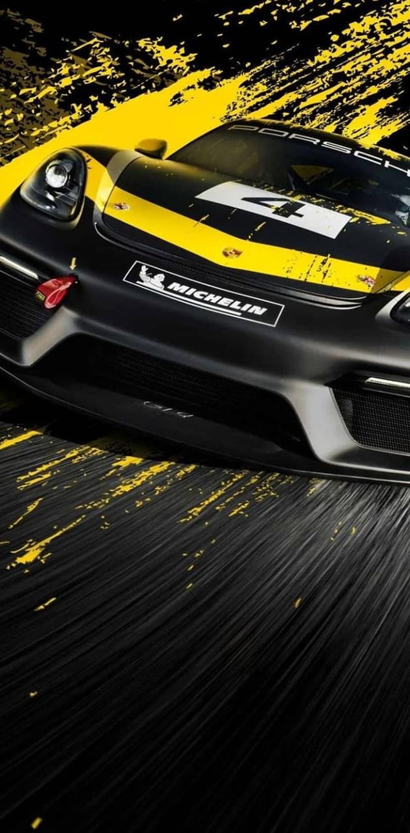 Black Porsche 718 Cayman GT4 RS racing car with a yellow stripe and Michelin logo on a splattered dark surface.