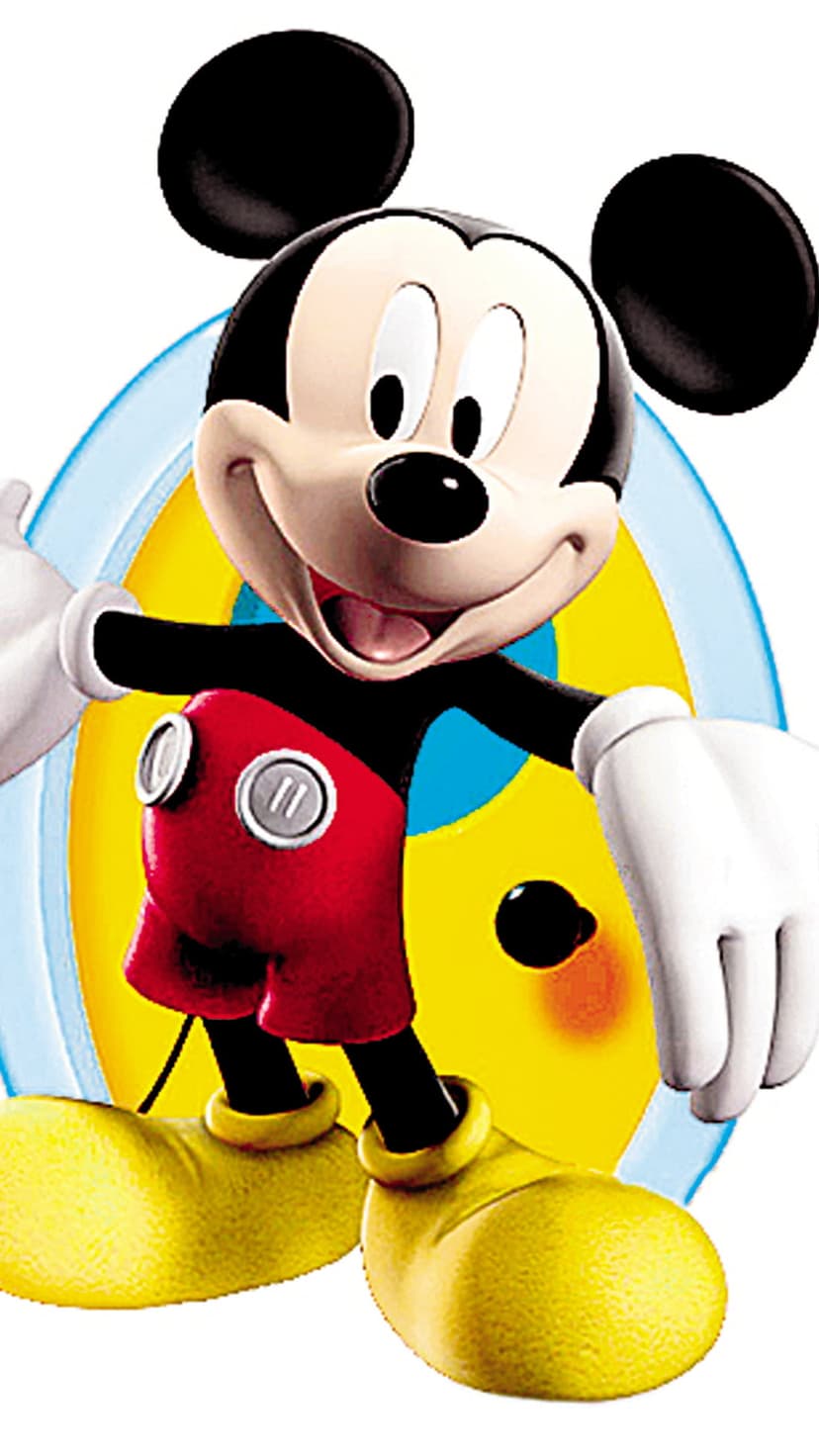 Mickey Mouse smiles while wearing red button shorts and yellow shoes against a layered blue and yellow background.