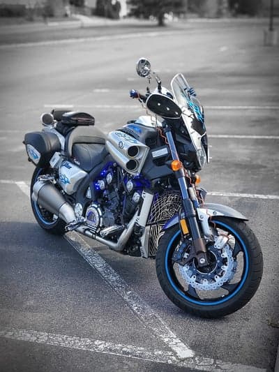 Customized Yamaha V-Max motorcycle with blue accents