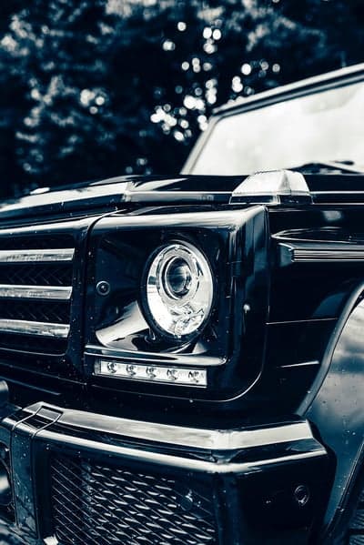 Close-up of a black Mercedes-Benz G-Class headlight