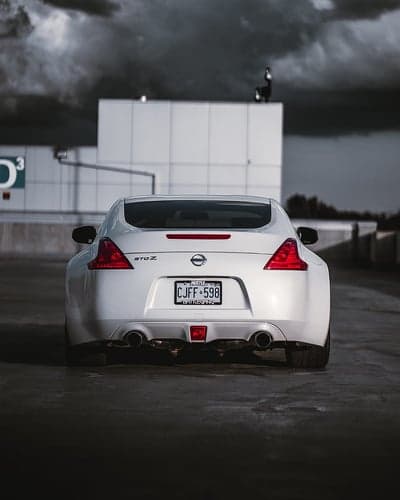 White Nissan 370Z Sports Car Rear Profile Phone Background