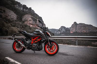KTM Duke Sportbike on Scenic Mountain Road Desktop Background