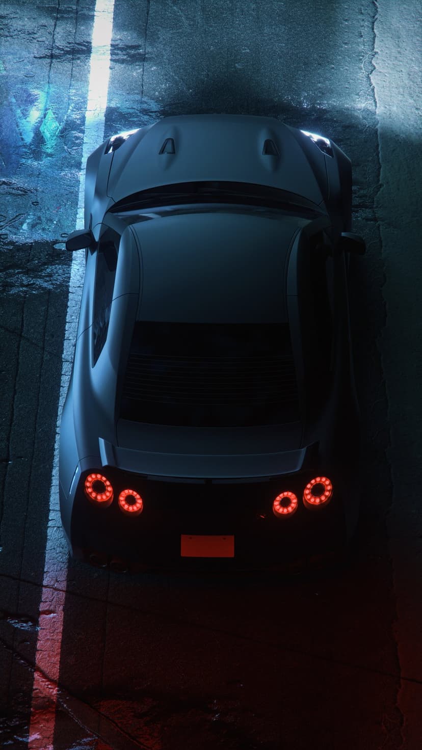 Dark sports car with glowing red circular taillights parked on a wet, reflective road under blue night light.