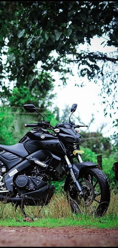Black Yamaha MT-15 Motorcycle Parked Outdoors