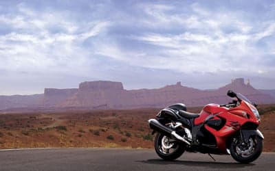 Red Suzuki Hayabusa Motorcycle in Desert Landscape Wallpaper