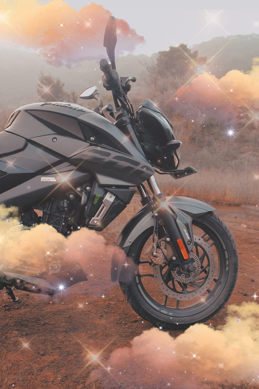 Dark motorcycle parked before misty mountains under a glowing purple nebula and twinkling stars at night.
