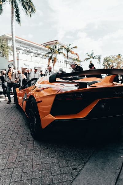Exotic Orange Lamborghini SVJ Vertical Supercar Wallpaper