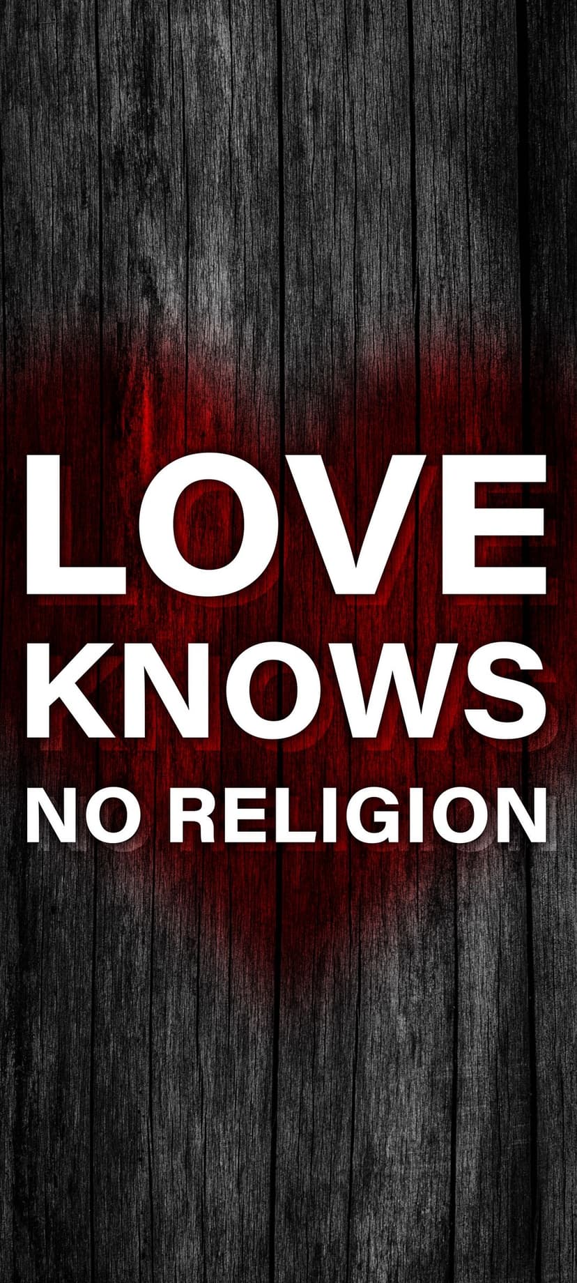 White block letters reading LOVE KNOWS NO RELIGION over dark wood planks with a faded red heart symbol.