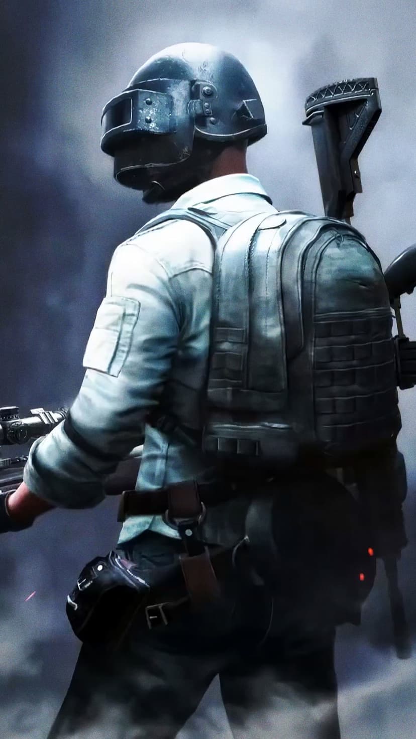 PUBG soldier wearing a level 3 helmet and tactical vest holds an assault rifle in a smoky, gritty environment.