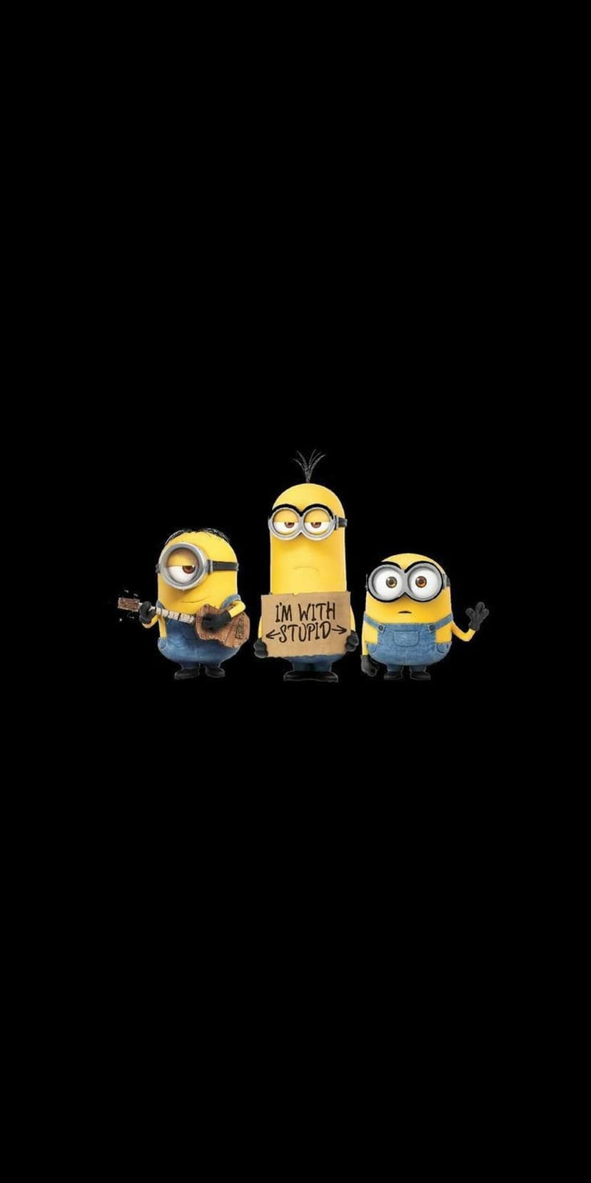 Three yellow Minions with goggles stand on a black background holding a ukulele and a hand-lettered sign.