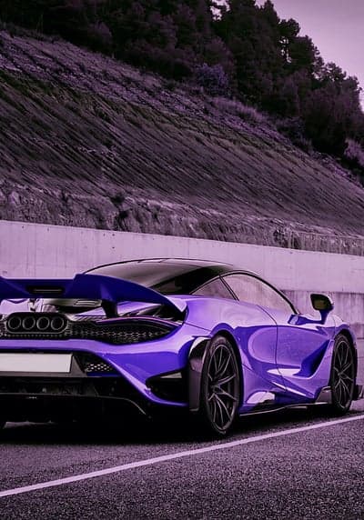 Purple McLaren Supercar on a Scenic Road