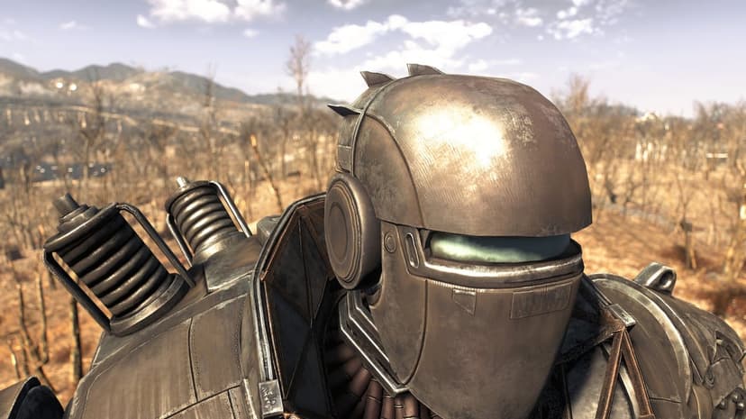 Liberty Prime robot with bronze metallic armor and a glowing teal eye slit in a dry post-apocalyptic landscape.