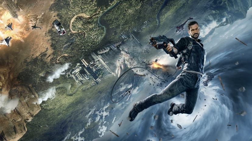 Rico Rodriguez flies through the air with a grappling hook and gun against a backdrop of a tornado and explosions.