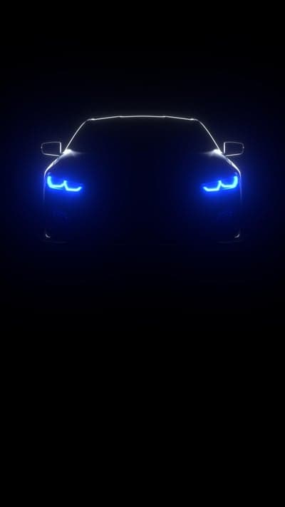 Futuristic Car with Blue LED Headlights in Darkness