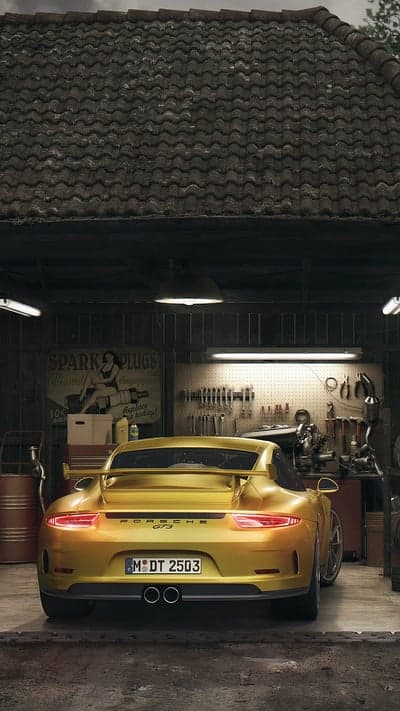 Golden Porsche GT3 in a Rustic Garage