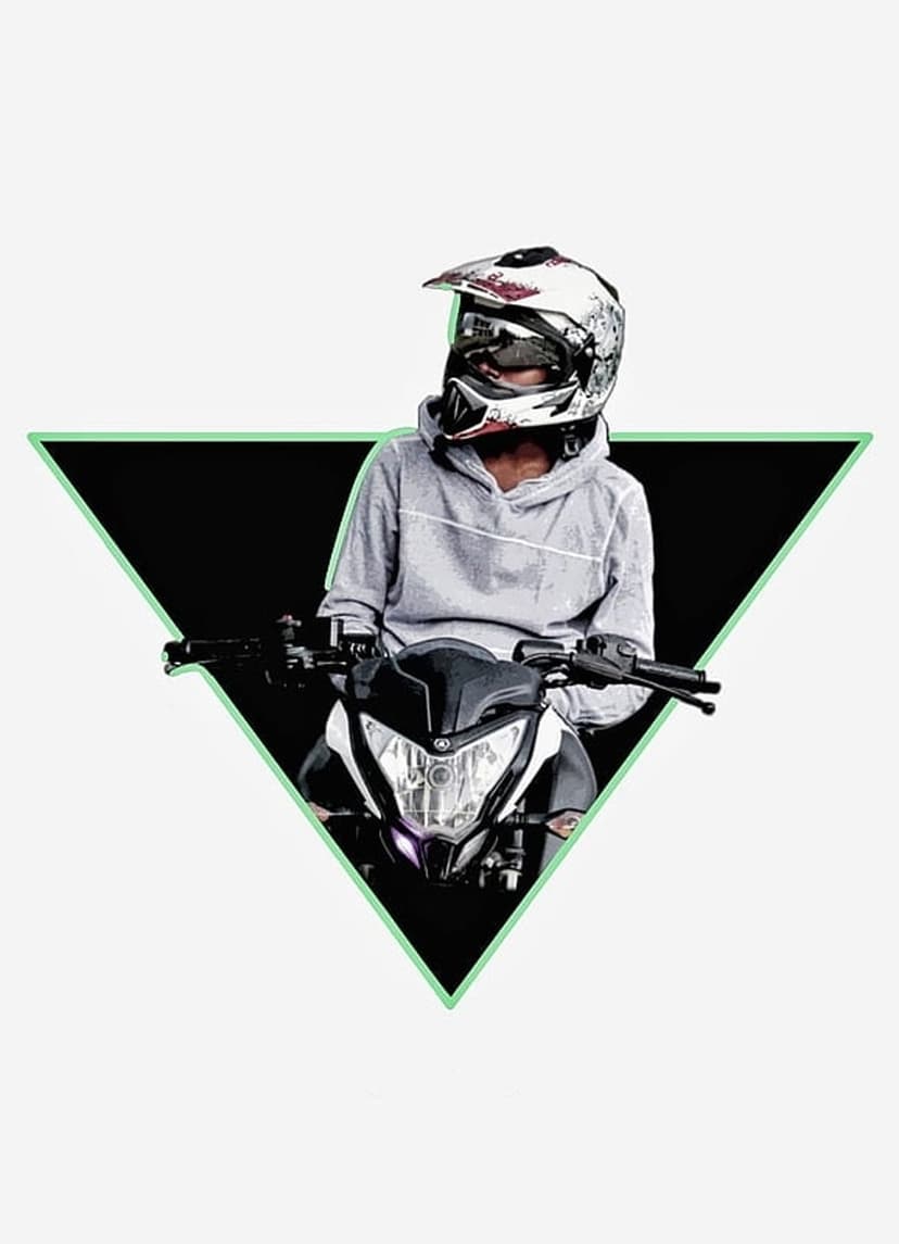 Motocross rider in a helmet sitting on a bike inside a glowing green triangle against a white background.