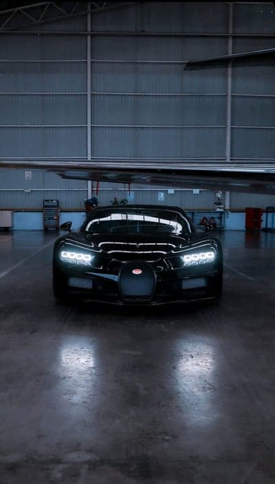 Sleek Black Bugatti Chiron in Hangar