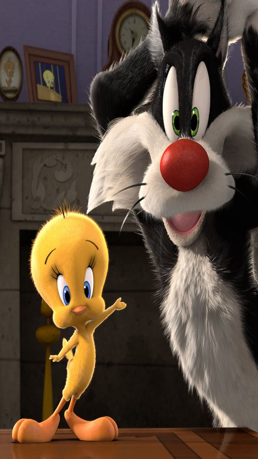 Sylvester the Cat stares at Tweety Bird standing on a mantelpiece inside a classic animated home interior.