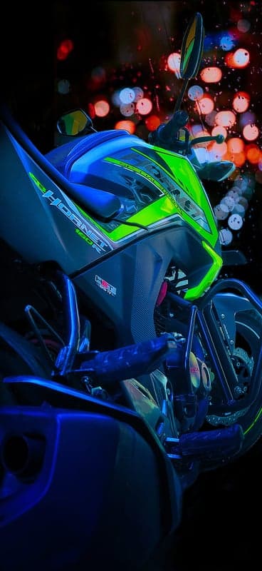 Neon Green Honda Hornet 160R Motorcycle at Night