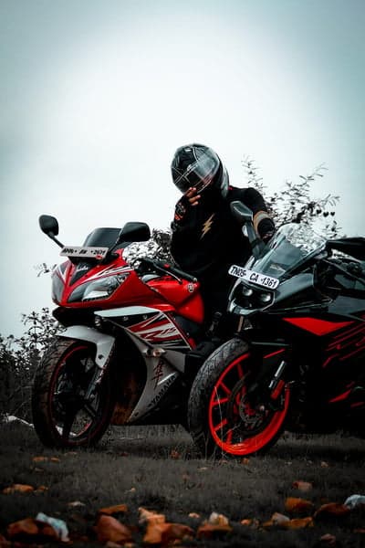 Rider and Yamaha R15 Motorcycles in Outdoor Setting